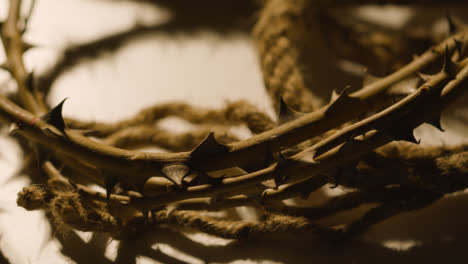 Religious-Concept-Shot-With-Close-Up-Of-Person-Picking-Up-Crown-Of-Thorns