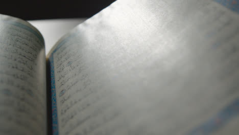 Handheld-Shot-of-Quran-Pages