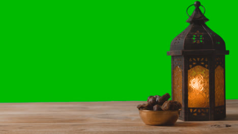 A-Tracking-Shot-of-Lantern-Dates-and-Water-In-Front-of-a-Green-Screen