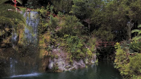 A-waterfall-cascades-down-into-a-tropical-pool