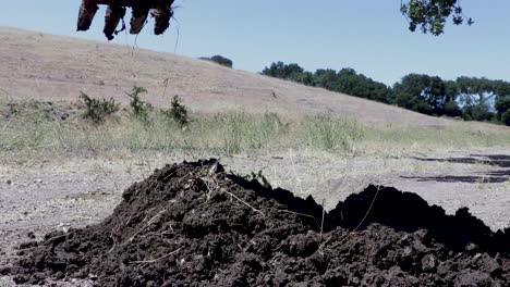 Backhoe-tractor-digging-up-a-leaking-water-line-on-a-hot-day-4