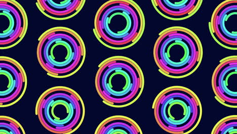 Rainbow-illusion-neon-circles-pattern-in-rows-in-dark-space