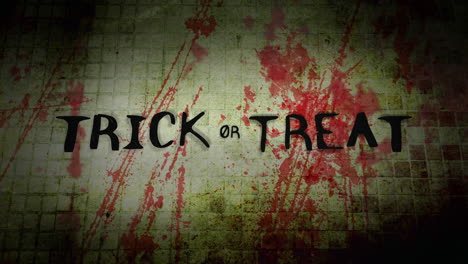 Trick-Or-Treat-on-dark-wall-texture-with-red-blood