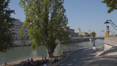 Quais-De-Seine-In-Paris-France-With-People-On-Banks-Of-River