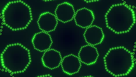 Circular-symmetrical-pattern-of-green-dots-on-black-background