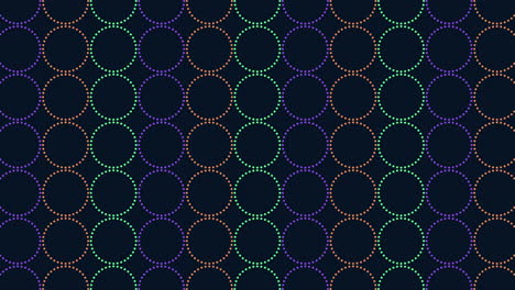 Symmetrical-repeating-pattern-of-colorful-circles-on-dark-background