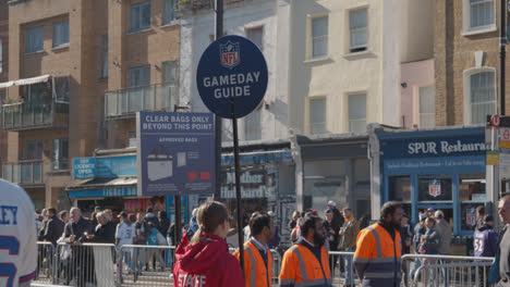 Crowd-Of-Supporters-And-Gameday-Guide-Seller-Outside-Tottenham-Hotspur-Stadium-For-2023-NFL-Games-London-2