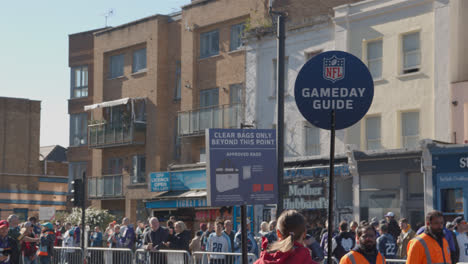 Crowd-Of-Supporters-And-Gameday-Guide-Seller-Outside-Tottenham-Hotspur-Stadium-For-2023-NFL-Games-In-London-1