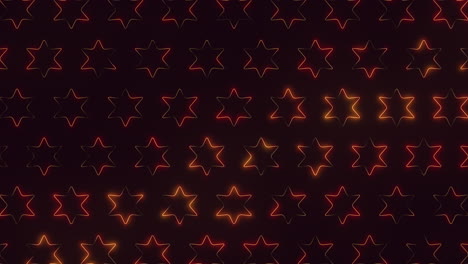 Starry-night-pattern-of-glowing-red-and-yellow-stars-on-black-background