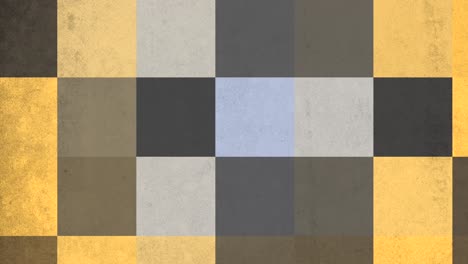 Gray,-blue,-and-yellow-checkered-concrete-wall-with-textured-industrial-appearance