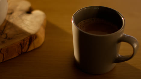 Close-Up-Of-Steaming-Cup-Of-Hot-Chocolate-Drink-On-Table-1