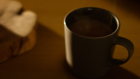 Close-Up-Of-Steaming-Cup-Of-Hot-Chocolate-Drink-On-Table