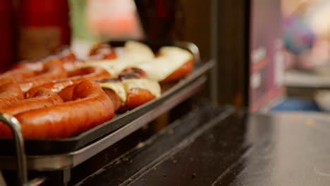 Close-Up-Of-Hot-Dogs-Cooking-On-Street-Food-Market-Stall-1