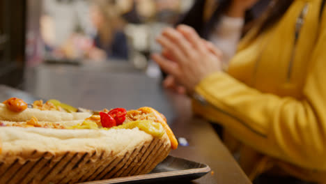 Close-Up-Of-Hot-Dogs-Cooking-On-Street-Food-Market-Stall