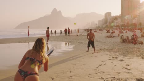 Playing-Paddle-Ball-on-Beach