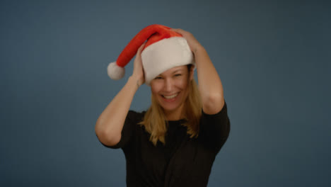 Woman-Flicks-Head-with-Santa-Hat
