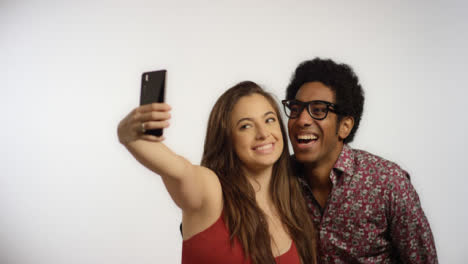 A-Couple-Take-Selfies-on-Phone