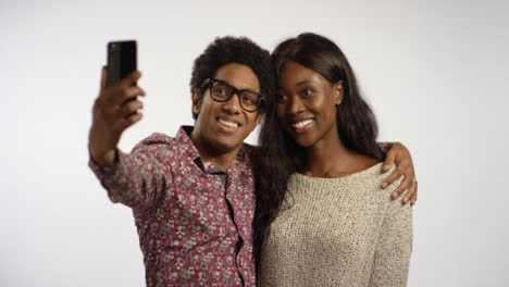 A-Couple-Take-Selfies-on-Phone