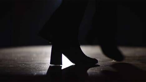 Young-Woman's-Feet-Dancing-in-Spotlight