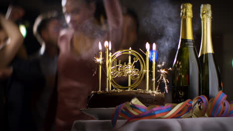 Birthday-Cake-With-Candles-Lit-On-Table-