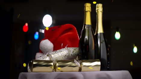 Champagne,-Christmas-Hat-and-Confetti-on-Table