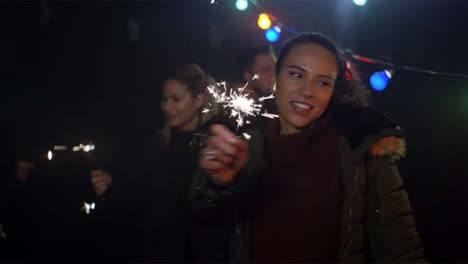 Young-Woman-Dances-With-Sparkler