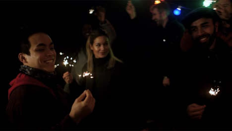 Group-of-Friends-Dancing-With-Sparklers
