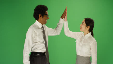 Two-people-high-5-on-green-screen