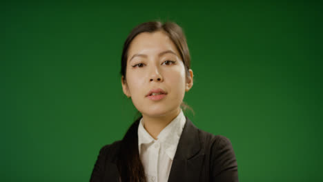 Businesswoman-crossing-arms-on-green-screen