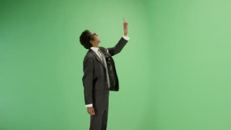 Businessman-trying-find-phone-signal-on-green-screen