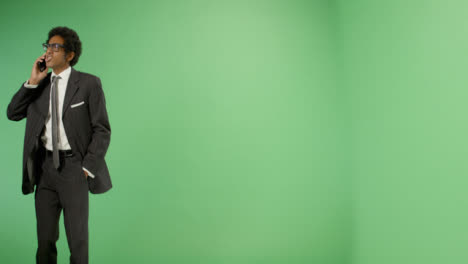 Angry-Businessman-talking-on-phone-with-green-screen