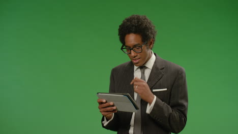 Businessman-Using-Tablet-While-Moving-on-Green-Screen