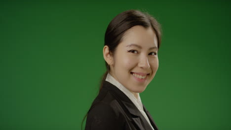 Businesswoman-Smiles-at-Camera-on-Green-Screen