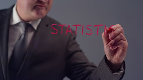 Businessman-Writing-Word-Statistics