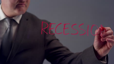 Geschäftsmann-Schreibt-Wort-Rezession