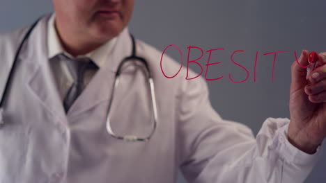 Doctor-escribiendo-la-palabra-obesidad