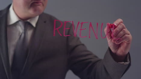 Businessman-Writing-the-Word-Revenue
