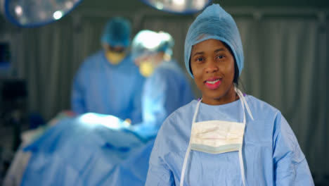 Female-Surgeon-Smiling-at-Camera