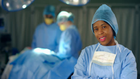 Portrait-Of-Female-Surgeon-In-Operating-Theatre