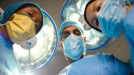 Medical-Staff-Looking-Down-at-Patient-in-Surgery