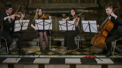 A-String-Quartet-Playing-Together-During-A-Performance