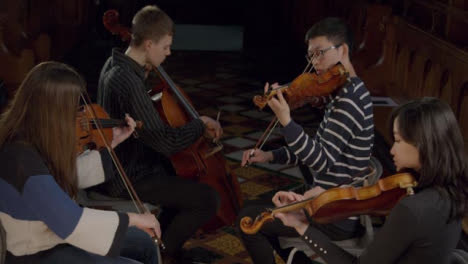 Looking-Down-at-String-Quartet-Playing-During-Performance