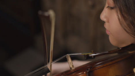 Close-Up-Of-A-Female-Violinist-During-Performance