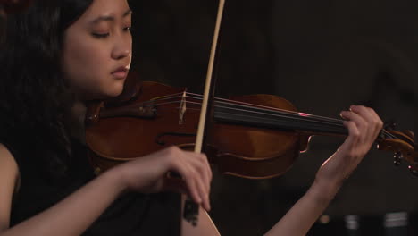 Panning-Close-Up-Of-Female-Violinist