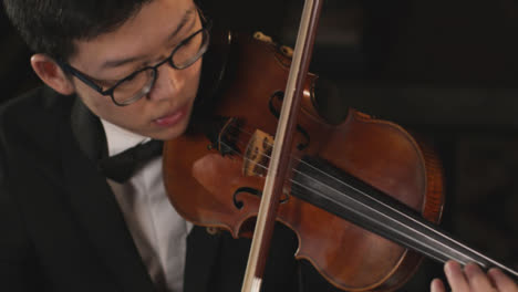 Male-Violinist-Playing-Violin-During-A-Performance