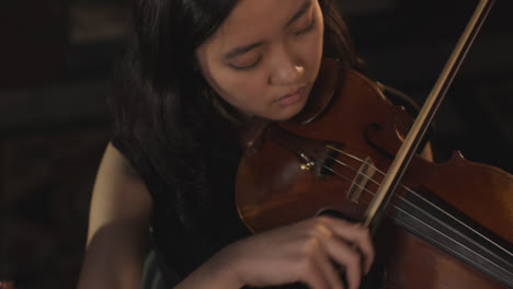 Female-Violinist-Playing-Violin-During-A-Performance