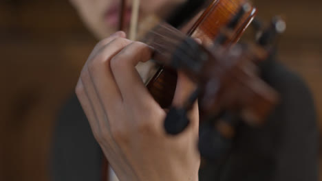 Close-Up-Of-Male-Cellist-And-Violinist-During-Performance-