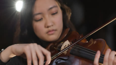Close-Up-Of-Female-Violinist-Playing