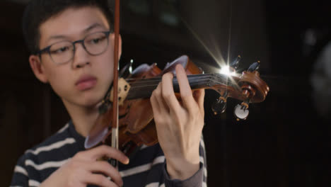 Camera-Moving-Around-Male-Violinist-Playing