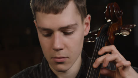 Tracking-In-Of-Male-Cellist-Playing
